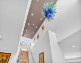 Stairway with Chihuly fixture view 1